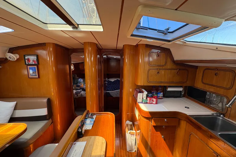 Slide: The Image of Interior of a 1990 Beneteau Oceanis 500 sailboat with wood finish and skylights. - 93