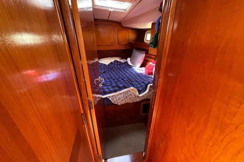 Slide: The Image of Cozy cabin interior of 1990 Beneteau Oceanis 500 sailboat with wooden finish. - 94