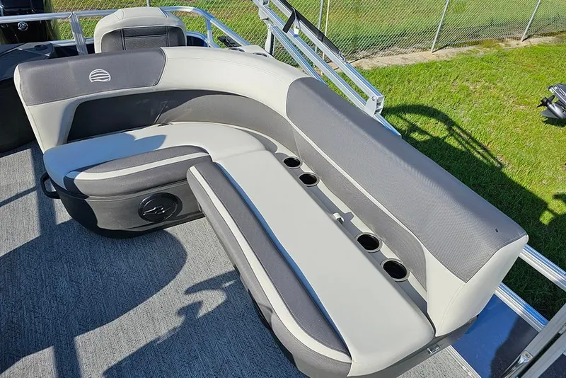 Slide: The Image of 2026 Sun Tracker Bass Buggy 18 DLX pontoon boat seating with cup holders, gray upholstery. - 12