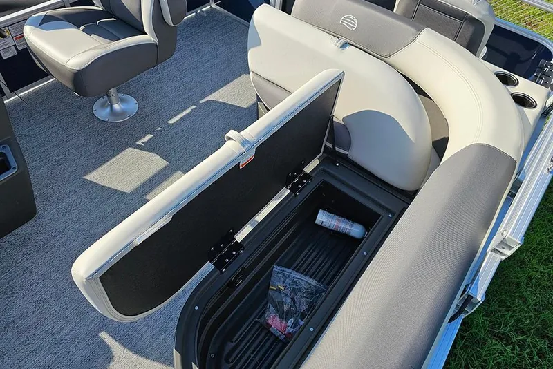 Slide: The Image of 2026 Sun Tracker Bass Buggy 18 DLX pontoon boat interior with open storage compartment. - 13