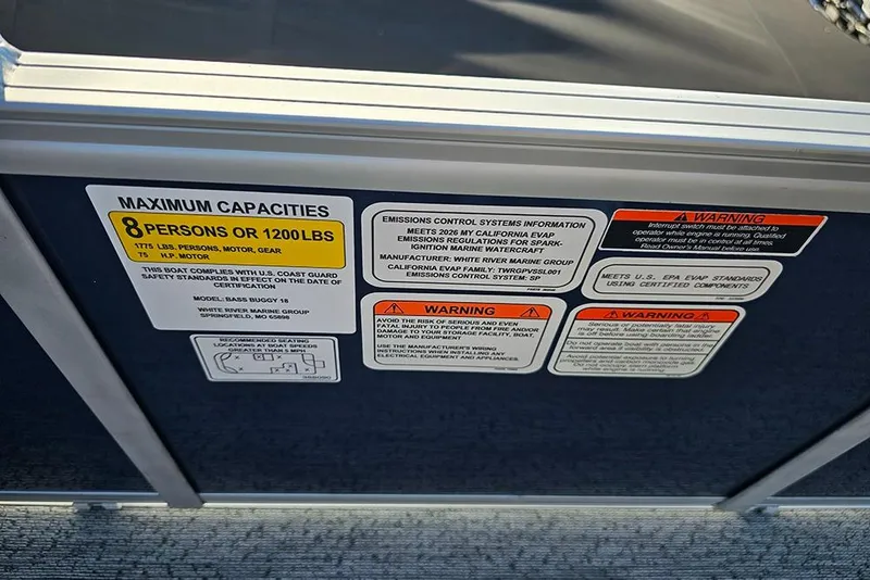 Slide: The Image of Capacity and warning labels on 2026 Sun Tracker Bass Buggy 18 DLX boat. - 16