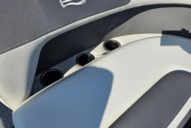 Slide: The Image of 2026 Sun Tracker Bass Buggy 18 DLX boat seating with integrated cup holders. - 25