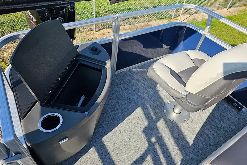 Slide: The Image of 2026 Sun Tracker Bass Buggy 18 DLX interior with seating and storage compartment. - 26