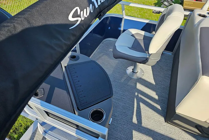 Slide: The Image of 2026 Sun Tracker Bass Buggy 18 DLX interior with seating and fishing station. - 8