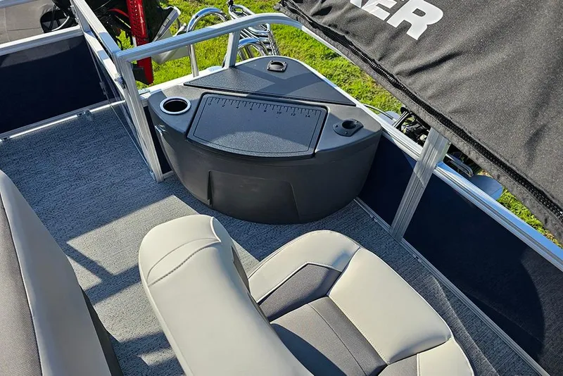 Slide: The Image of 2026 Sun Tracker Bass Buggy 18 DLX interior with seating and storage area. - 9