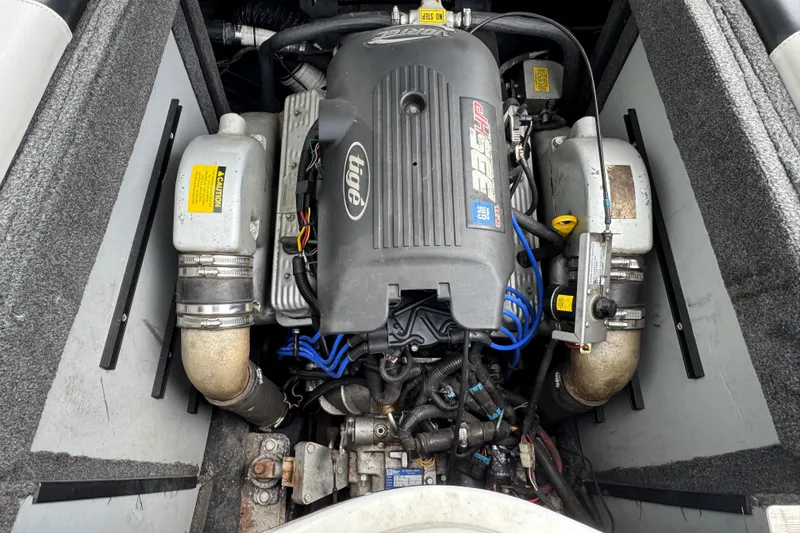 Slide: The Image of 2004 Tigé 22V Riders Edition boat engine compartment, showcasing detailed components and wiring. - 8