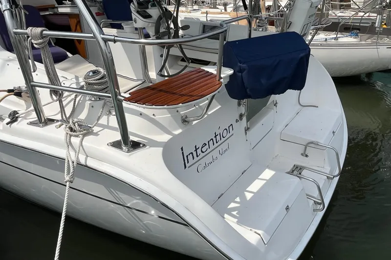 Slide: The Image of Hunter 36-2 sailboat, 2006 model, docked with visible deck and railing. - 12