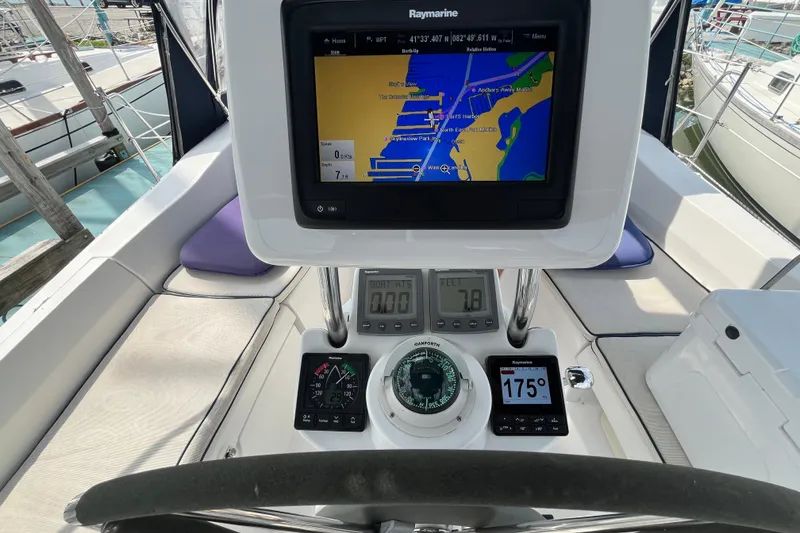 Slide: The Image of Cockpit of 2006 Hunter 36-2 sailboat with navigation equipment and Raymarine display. - 14