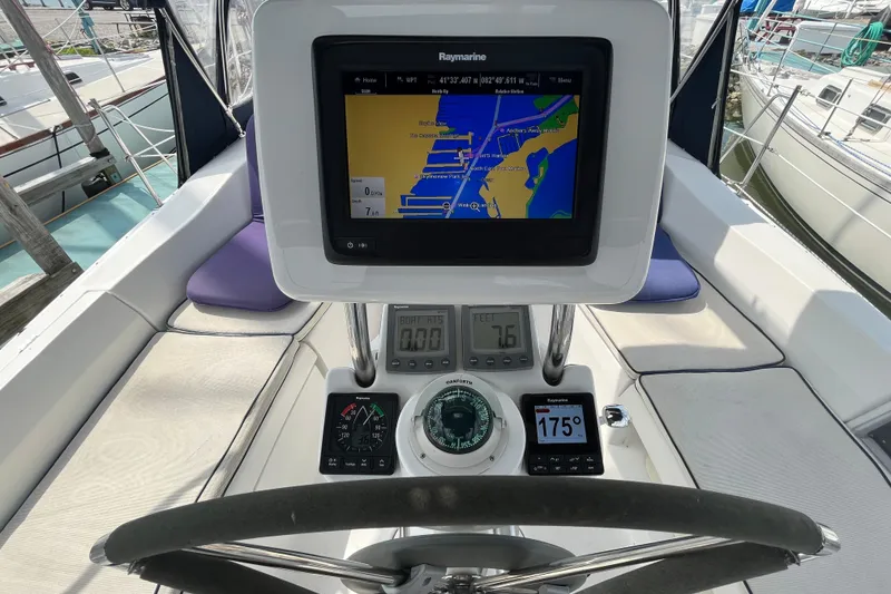 Slide: The Image of Cockpit of 2006 Hunter 36-2 sailboat with navigation equipment and steering wheel. - 15