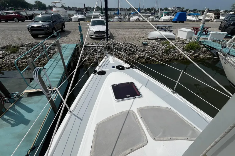 Slide: The Image of Sailboat docked at marina, Hunter 36-2, 2006 model, with visible deck and rigging. - 2