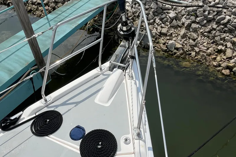 Slide: The Image of 2006 Hunter 36-2 sailboat bow with ropes and railing at dockside. - 3