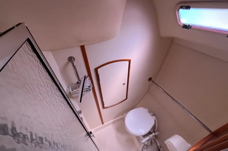 Slide: The Image of Compact bathroom in 2006 Hunter 36-2 sailboat with shower and toilet. - 30