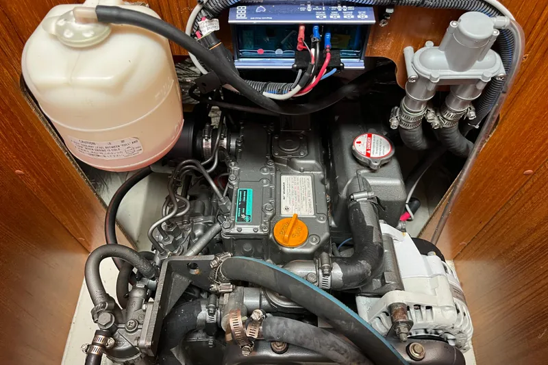 Slide: The Image of Engine compartment of a 2006 Hunter 36-2 sailboat, showing detailed mechanical components. - 36