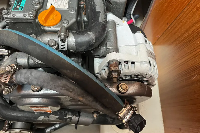 Slide: The Image of Engine components of a 2006 Hunter 36-2 sailboat, featuring hoses and clamps. - 37