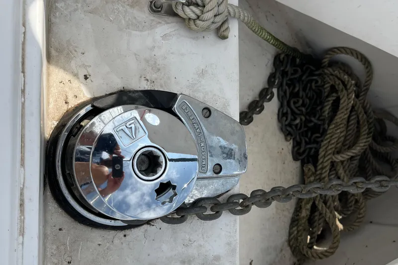 Slide: The Image of Anchor windlass on a 2006 Hunter 36-2 sailboat with chain and rope. - 4