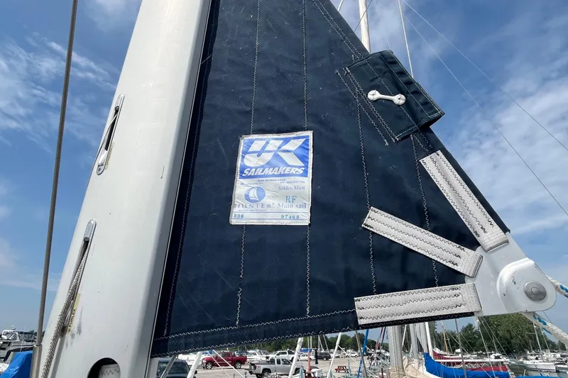 Slide: The Image of Sail of a 2006 Hunter 36-2 yacht with UK Sailmakers label, docked at marina. - 5