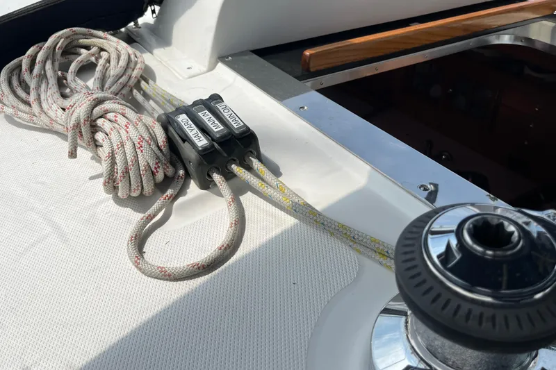 Slide: The Image of Deck of 2006 Hunter 36-2 sailboat with halyard and main outhaul lines. - 6
