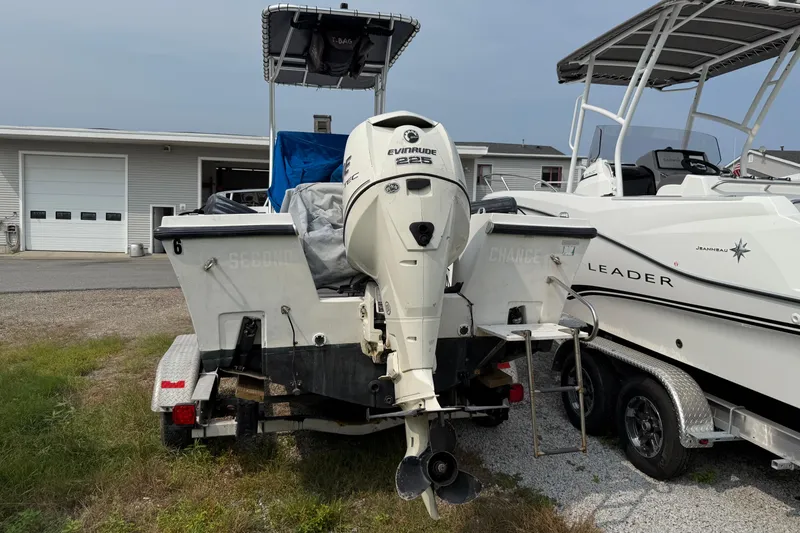 Slide: The Image of 2001 Mako 221 Center Console boat with Evinrude 225 engine on trailer. - 3