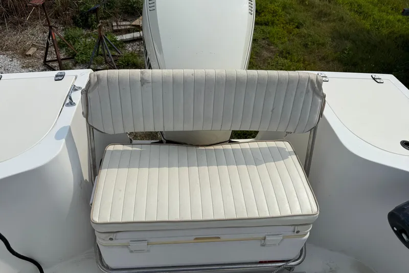 Slide: The Image of White cushioned seat on a 2001 Mako 221 Center Console boat. - 4