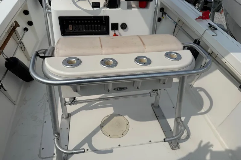 Slide: The Image of 2001 Mako 221 Center Console boat interior with seating and rod holders. - 5
