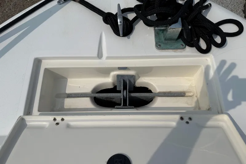 Slide: The Image of Anchor storage compartment on a 2001 Mako 221 Center Console boat. - 7