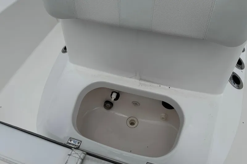 Slide: The Image of 2015 BlackJack 224 Bay boat seat with storage compartment, white interior. - 20