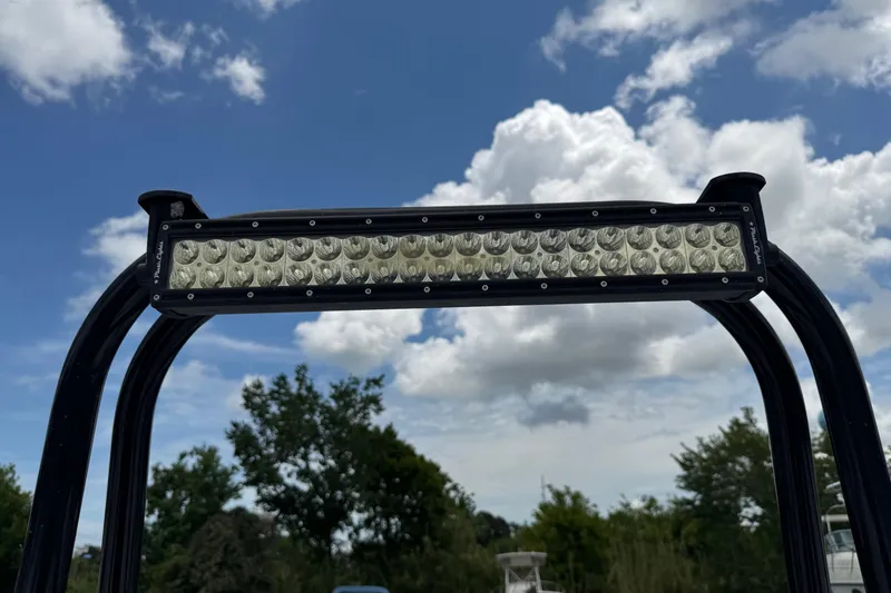 Slide: The Image of LED light bar on a 2015 BlackJack 224 Bay boat against a cloudy sky. - 27