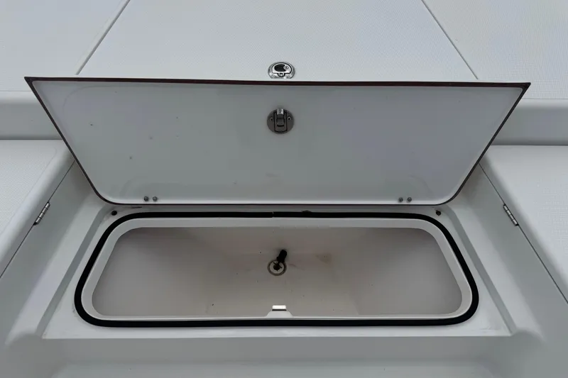 Slide: The Image of Open storage compartment on a 2015 BlackJack 224 Bay boat. - 36