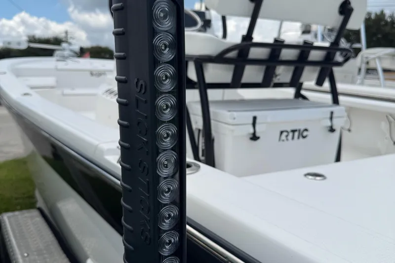 Slide: The Image of 2015 BlackJack 224 Bay boat with RTIC cooler and Slick Sticks accessory. - 7