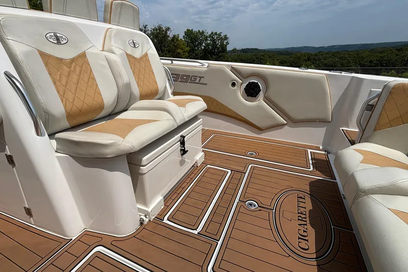 Slide: The Image of 2014 Cigarette 39 GTS boat interior with tan and white seating, teak-style flooring. - 12