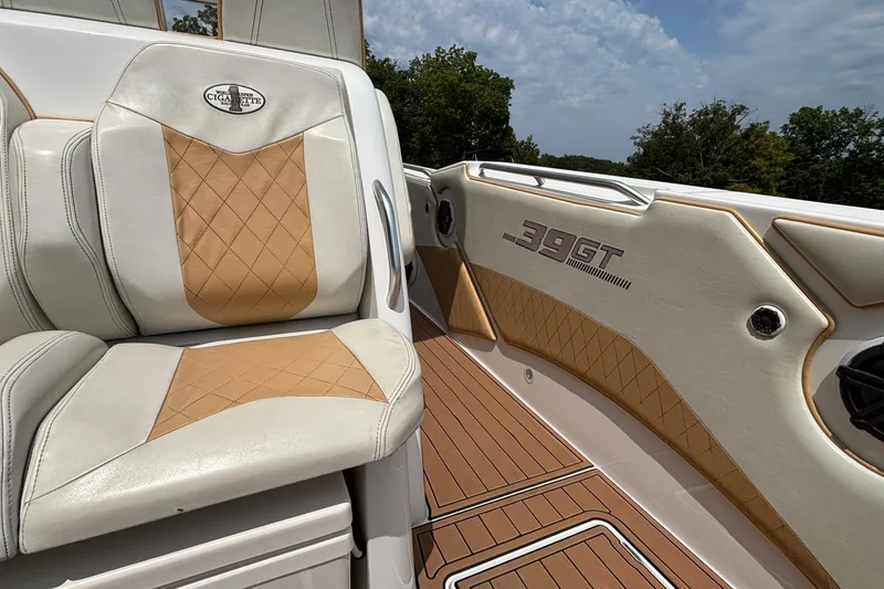 Slide: The Image of 2014 Cigarette 39 GTS boat interior with tan and white leather seating. - 15