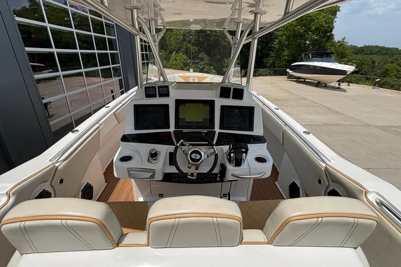 Slide: The Image of 2014 Cigarette 39 GTS boat cockpit with modern navigation equipment and dual seating. - 19