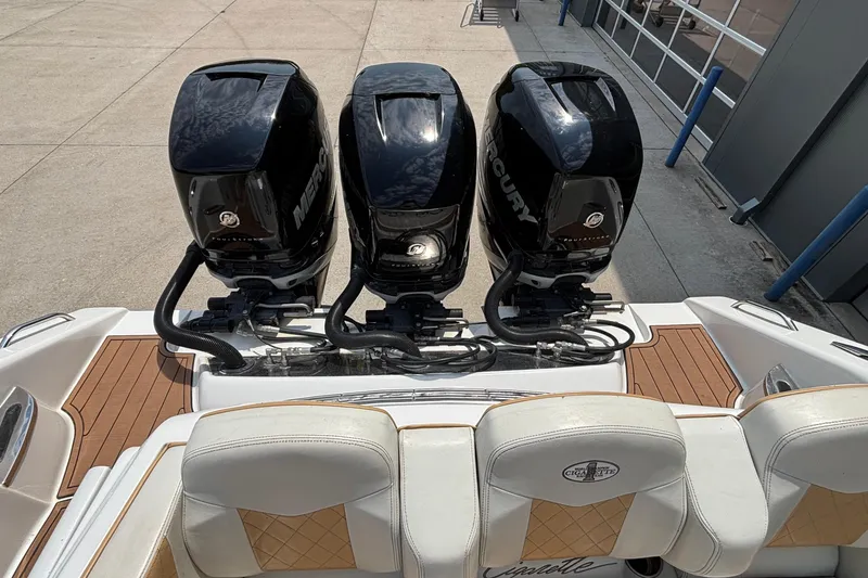 Slide: The Image of 2014 Cigarette 39 GTS boat with triple Mercury outboard engines, rear view. - 7