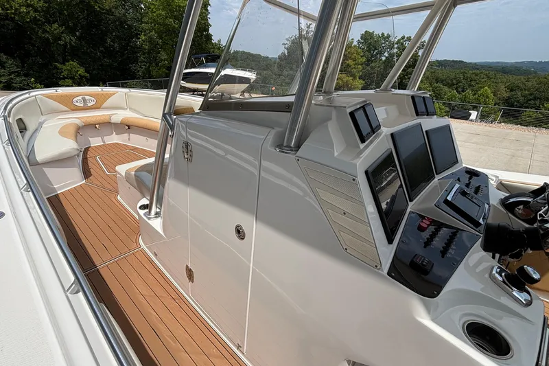Slide: The Image of 2014 Cigarette 39 GTS boat interior with modern dashboard and seating area. - 27