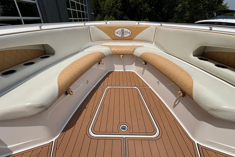 Slide: The Image of 2014 Cigarette 39 GTS boat interior with tan and white seating, teak flooring. - 30