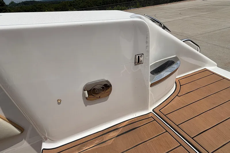 Slide: The Image of 2014 Cigarette 39 GTS boat deck with wood finish and chrome details. - 13