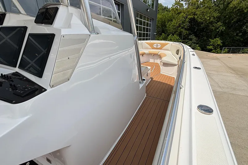 Slide: The Image of 2014 Cigarette 39 GTS boat with sleek white exterior and luxurious deck. - 32
