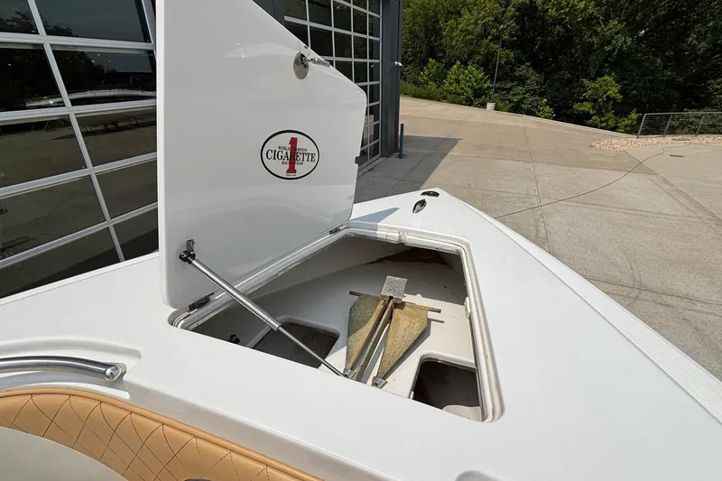 Slide: The Image of 2014 Cigarette 39 GTS boat anchor compartment open, showcasing storage space. - 35