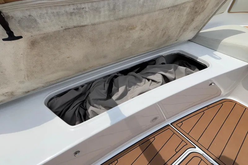 Slide: The Image of Storage compartment on 2014 Cigarette 39 GTS boat with cover inside. - 41