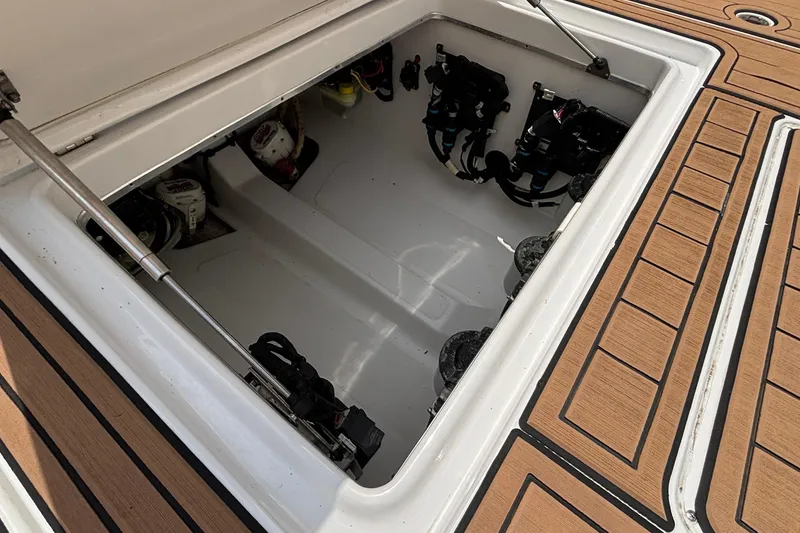 Slide: The Image of Open engine compartment of a 2014 Cigarette 39 GTS boat, showcasing interior components. - 44
