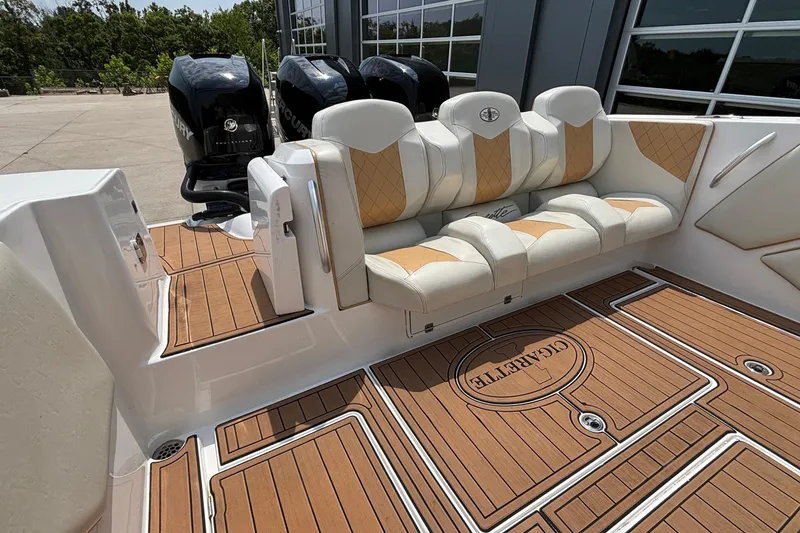 Slide: The Image of 2014 Cigarette 39 GTS boat interior with luxurious seating and Mercury engines. - 8