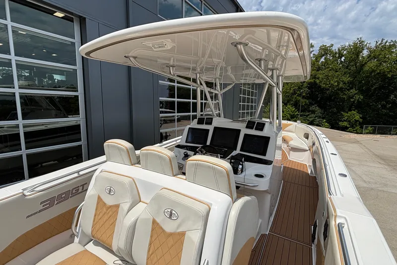 Slide: The Image of 2014 Cigarette 39 GTS boat with luxurious seating and advanced navigation systems. - 17
