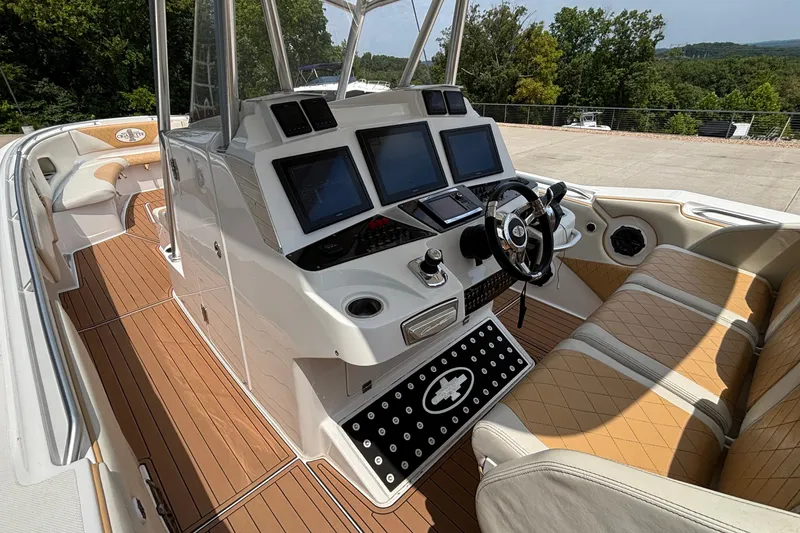 Slide: The Image of 2014 Cigarette 39 GTS boat interior with modern dashboard and luxurious seating. - 24