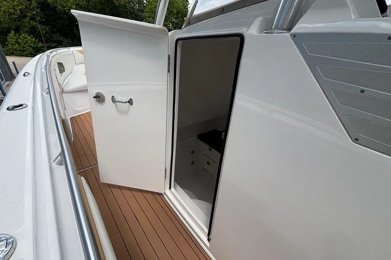 Slide: The Image of 2014 Cigarette 39 GTS boat with open cabin door and teak flooring. - 38