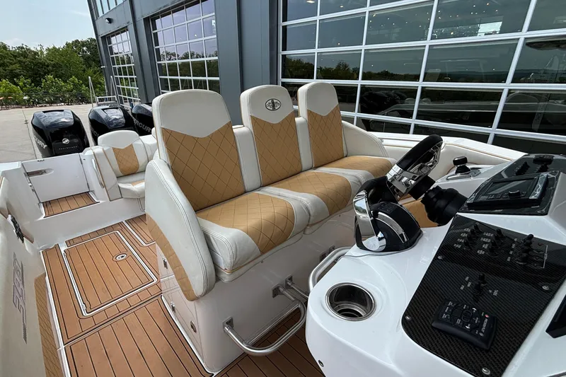 Slide: The Image of 2014 Cigarette 39 GTS boat interior with luxury seating and control panel. - 36
