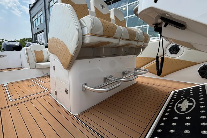 Slide: The Image of 2014 Cigarette 39 GTS boat interior with luxurious seating and teak flooring. - 37