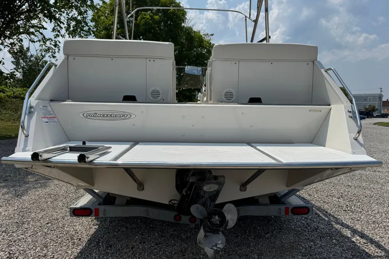 Slide: The Image of 2004 Princecraft Vacanza 250 I/O boat rear view with swim platform and ladder. - 10