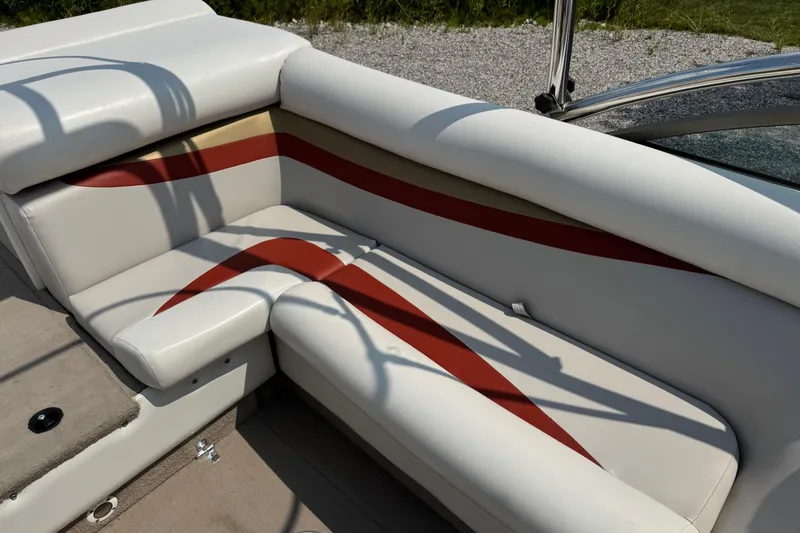 Slide: The Image of 2004 Princecraft Vacanza 250 I/O boat interior with white and red seating. - 13