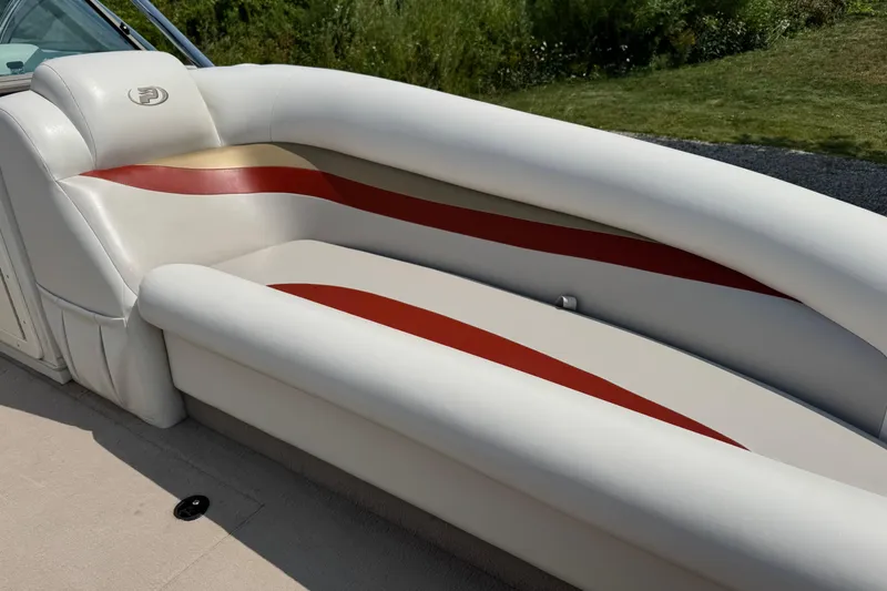Slide: The Image of 2004 Princecraft Vacanza 250 I/O boat interior with white and red seating. - 5