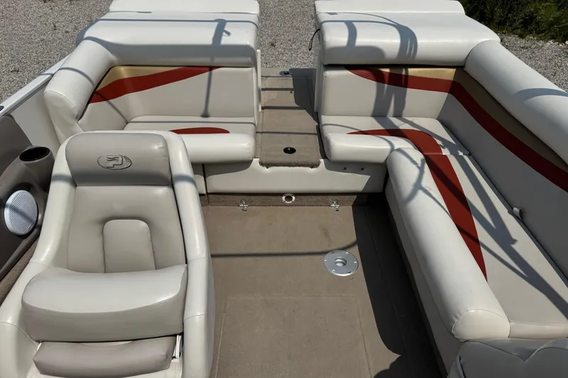 Slide: The Image of 2004 Princecraft Vacanza 250 I/O boat interior with beige and red seating. - 6